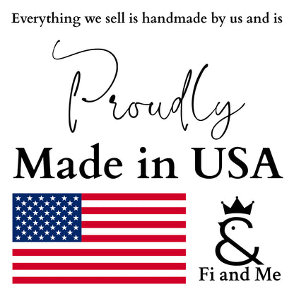 A square white graphic with black text reading 'Everything we sell is handmade by us and is Proudly Made in USA,' an American flag illustration, and a black ampersand logo with a crown above the words 'Fi and Me.'.